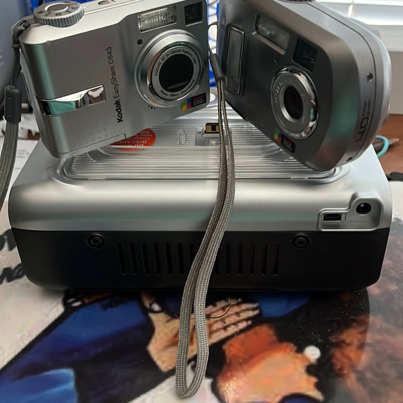 I’m selling both cameras with docking station for printing
